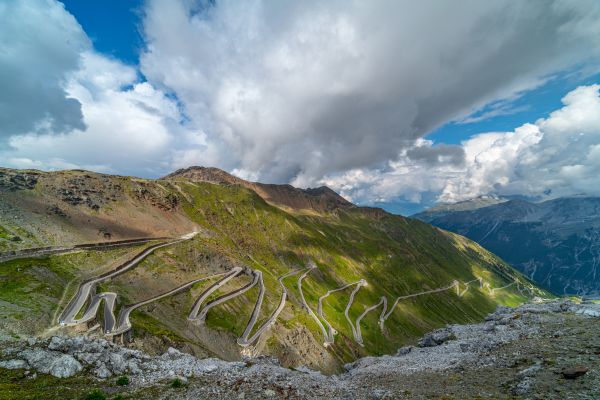 Stelvio Pass (Lombardy, Italian Alps): Start from Bormio, ride 48 hairpin turns with dramatic elevation and charming Alpine villages.