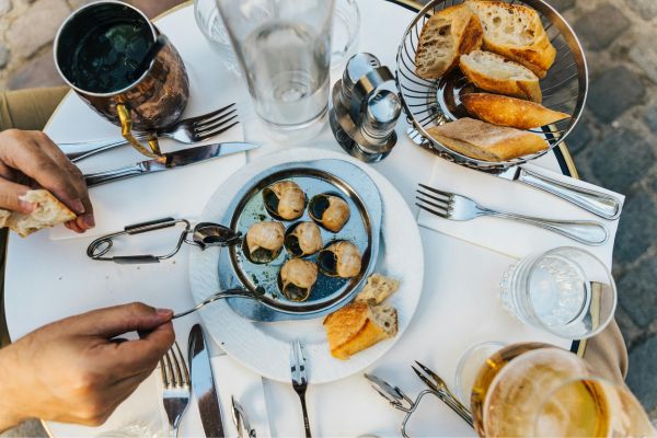 Escargots: Snails cooked in garlic & butter. Popular in Lyon, though not unique to the city