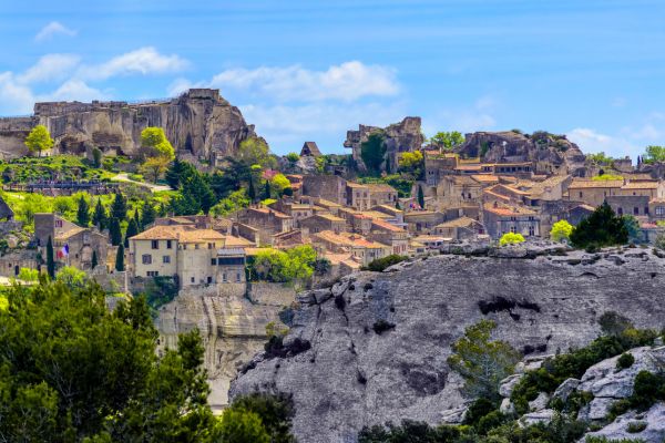 Les Baux-de-Provence: Dramatic village perched on a rugged limestone spur in the Alpilles, featuring medieval ruins, historical monuments, and the famous Carrières de Lumières light show