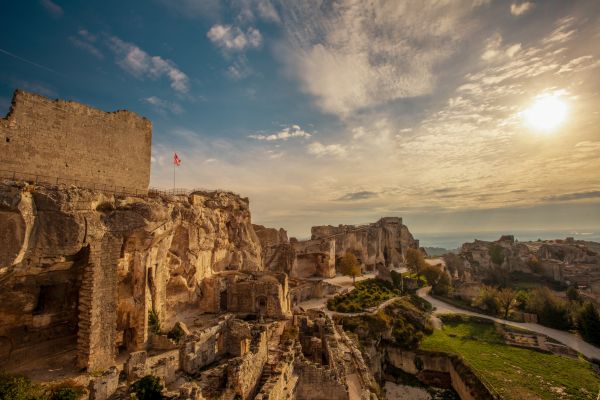 Les Baux-de-Provence: Dramatic village perched on a rugged limestone spur in the Alpilles, featuring medieval ruins, historical monuments, and the famous Carrières de Lumières light show