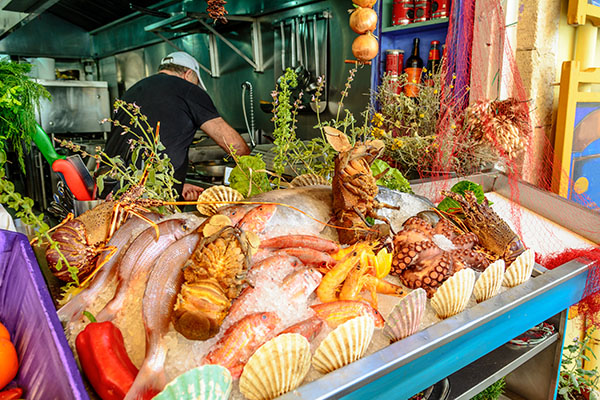 Fresh seafood served at Greek restaurant in Rethymno city on Crete island