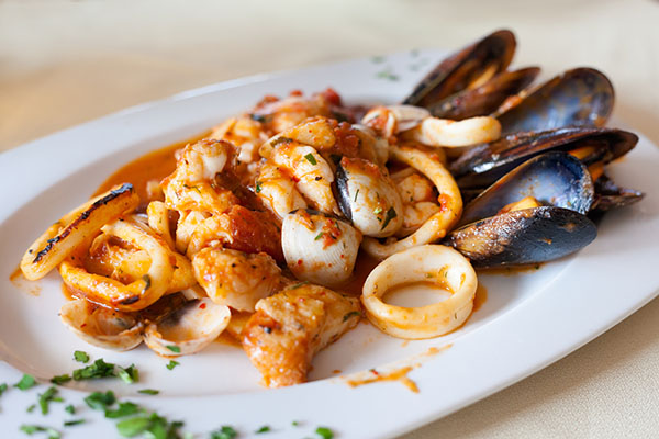 Fresh fried spicy seafood plate mixed diablitos style served in local restaurant in Los Gigantes