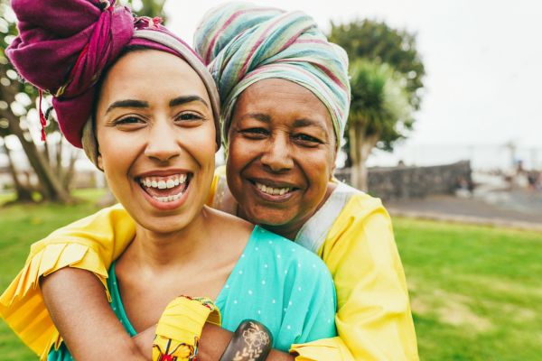African mother and daughter wearing traditional clothes .