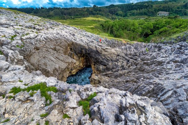 Playa de las Cuevas ("Beach of the Caves"), Llanes, Asturias: a dramatic natural landmar, unique rock formations and sea caves.