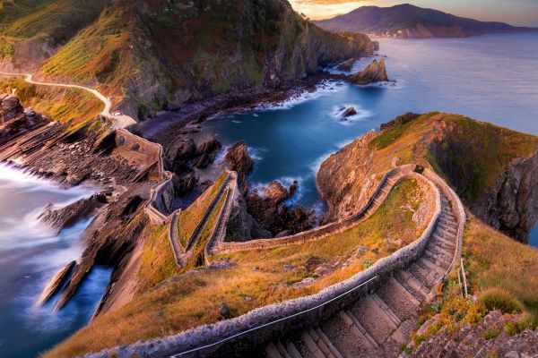 San Juan de Gaztelugatxe, Basque Country: part of a protected Biotope known for its dramatic eroded landscape of sea caves, natural arches, and steep cliffs. A free entry permit is required to access.