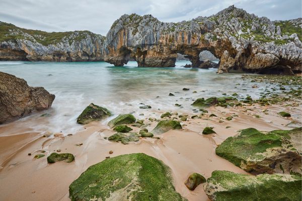 Playa de las Cuevas ("Beach of the Caves"), Llanes, Asturias: a dramatic natural landmar, unique rock formations and sea caves.