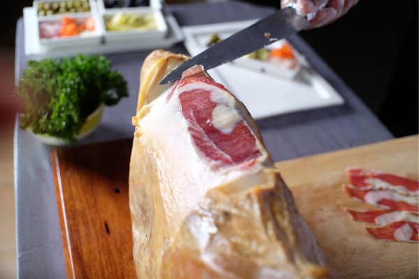 Jamón Ibérico, Spain’s king of cured ham: Deep red and intensely nutty, made from acorn-fed black pigs. Look for Black Label (Pata Negra) for the 100% acorn-fed variety.