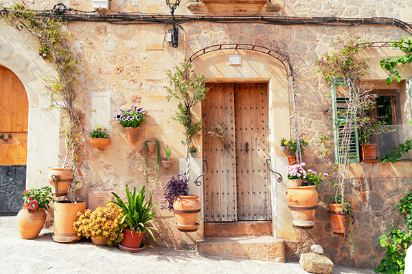 wall with traditional flower pots in old town of Valdemossa, Majorca, Spain