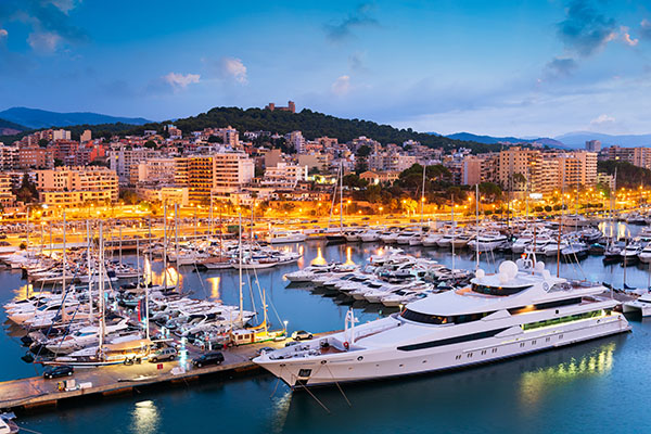 Early morning view of Palma de Mallorca port with yachts and calm sea